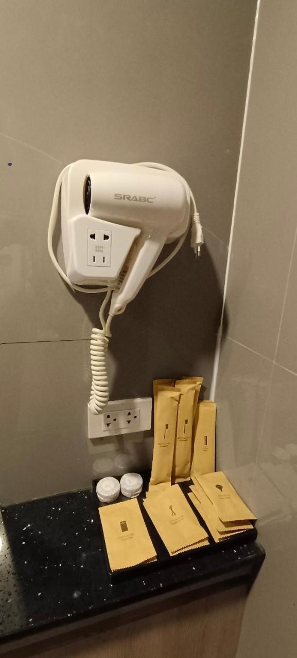 The Airport Courtyard Suvarnabhumi Airport Bangkok Bagian luar foto A hair dryer in a hotel bathroom